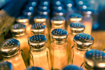 rows of traditional style salt shakers