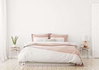 light, cute and cozy home bedroom interior with unmade bed, pink plaid and cushions on empty white w