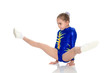A girl gymnast performs exercises on the floor.