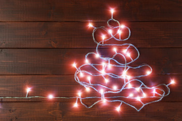 Wall Mural - Luminous garland in the form of Christmas tree