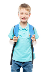 boy with backpack ready to go to school, portrait on white background isolated