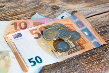 Euro bills and coins - cash money