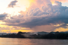 View Of Mekong River With A Mountain Background At Sunset With A Beautiful Clouds