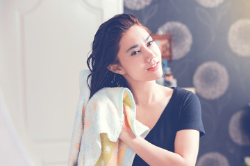 Wall Mural - Young woman with wet hairs in bathroom