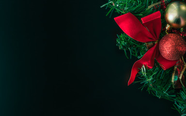 decorated christmas wreath on a black surface