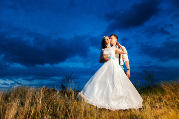 the bride and groom are photographed on the nature