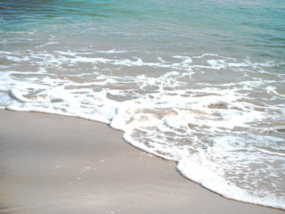 Close up white wave of sea water splashed on the beach,in morning time,beauty by nature