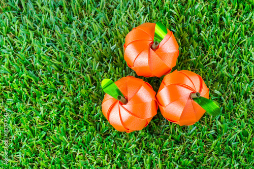 Cuadros en Lienzo Coin folding with Ribbon is shaped orange fruit for ordination scatter ceremony of buddhism
