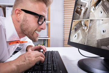 Aufkleber - Businessman Looking CCTV Footage In Office