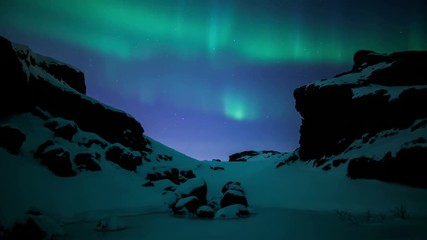 Wall Mural - brilliant aurora borealis moving snowy volcanic mountain pass reykjavik iceland.mov