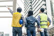 © TeTe Song - Back view of Three workers checking last details on a construction site