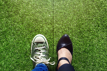 Wall Mural - Life Balance concept for Work and Travel present in top view position over green grass field by half of Business Working Woman and Sneaker Shoes