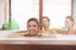 © Kalim - Group of friends enjoying jacuzzi in hotel spa