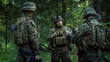 © Gorodenkoff - Squad Leader Discusses Military Operation Details with Soldiers, Commander Gives Orders. Fully Equipped and Armed Soldiers Ready for Mission in a Dense Forest.