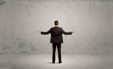 Wall Mural - Businessman lost in empty urban space