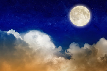 Naklejka na meble Full moon rising above glowing clouds in night sky