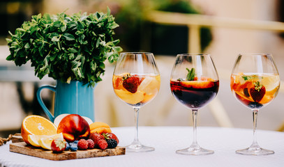 Delicious Red Sangria with fruits on table