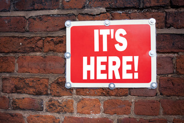 Poster - Hand writing text caption inspiration showing It's Here concept meaning advertisement written on old announcement road sign with background and copy space