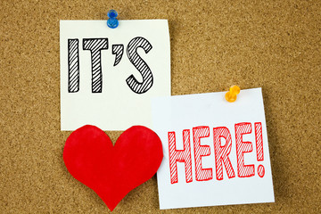 Poster - Conceptual hand writing text caption inspiration showing It's Here concept for advertisement and Love written on sticky note, reminder cork background with copy space