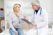 © pressmaster - Female patient complaining to doctor about sore throat and other symptoms of flu