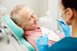 © pressmaster - Aged man complaining about problems with teeth before dental check-up