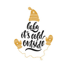 2135618 Baby It's Cold Outside. Hand Drawn Calligraphy Text. Holiday Typography Design With Hat And Mittens. Black And Gold Christmas Card