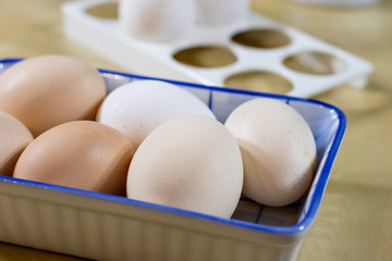 Egg, milk and jug on the kitchen table. Kitchen table with food products.