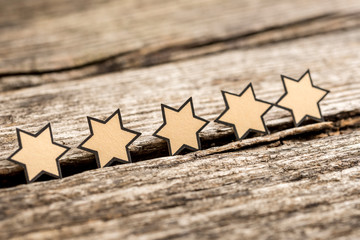 Wall Mural - five stars on a rustic wooden boards