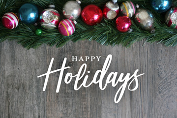 Wall Mural - happy holidays calligraphy with festive colorful holiday christmas ornament border over garland and 
