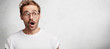 © WHstudio Leushin N - Horizontal isolated shot of surprised male college teacher, wears spectacles, wonders that he should work on weekends, doesn`t expect to hear about expel of clever student, poses against concrete wall