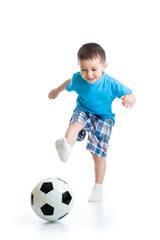 Full length portrait of kid boy playing with soccer ball isolated on white background