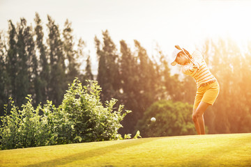 Woman golfers hit sweeping and keep golf course in the summer for relax time