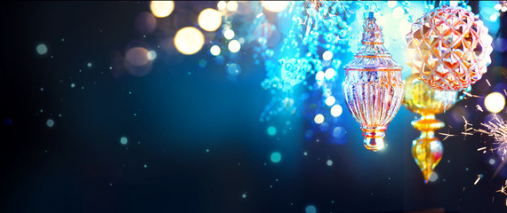 Wall Mural - christmas and new year golden decorations over blinking night background. wide angle