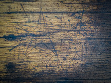 Details Of A Wooden Surface With A Carved Star