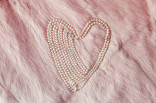 Elegant Pearl Necklace On Pink Fur Shape Of A Heart