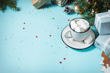 Winter Hot Drink. Christmas Hot Chocolate Or Cocoa With Marshmallow On Blue Background With Christmas Decorations. Copy Space
