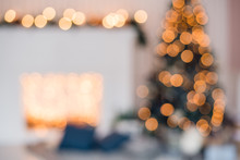 Blurred Christmas Background With Fireplace And Christmas Tree