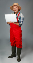 Sticker - Agronomist with laptop on grey background