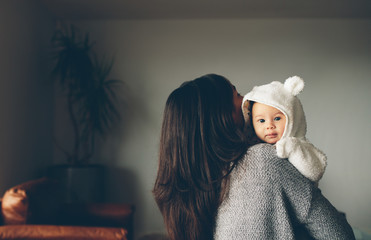mother holding her cute little son