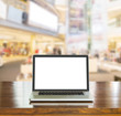 © littlestocker - Blank screen laptop computer with blur shopping mall background