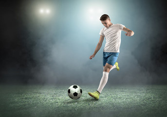 Sticker - Soccer player on a football field in dynamic action at summer da