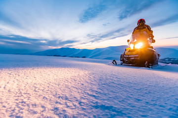 Wall Mural - A rider on the snowmobile.