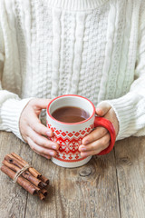 Canvas Print - hot winter drink in hands