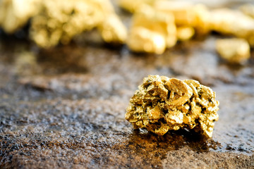 Wall Mural - The pure gold ore found in the mine on a stone floor