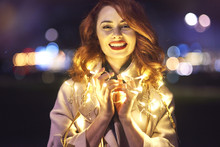 Cheerful Woman With Light Bulb