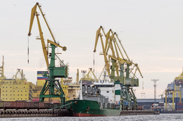 Wall Mural - Cargo freight ship and cargo container working with crane at port area,Logistic Import Export.