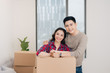 © makistock - Young asian couple moving to a new apartment together.