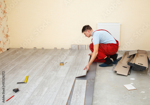Handyman Laying Down Laminate Flooring Boards Buy This Stock