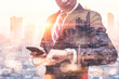 © TimeStopper - The double exposure image of the business man looking to a watch and smartphone during sunrise overlay with cityscape image. The concept of modern life, business, city life and internet of things.