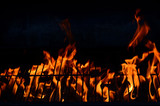 Fototapeta Miasto - Black background with flames (red-hot grill)
